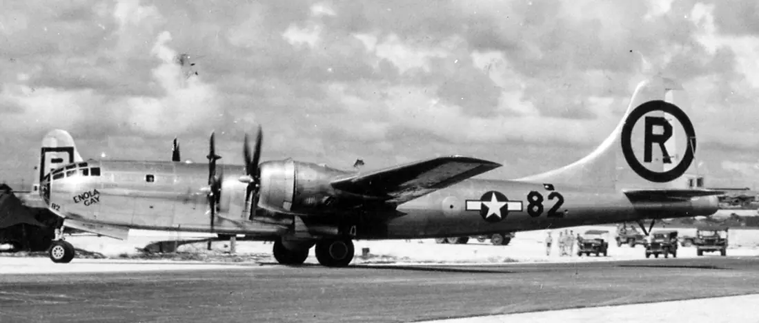 Enola Gay departs for Hiroshima, ushering in the nuclear age — Tinian Island, Pacific Ocean